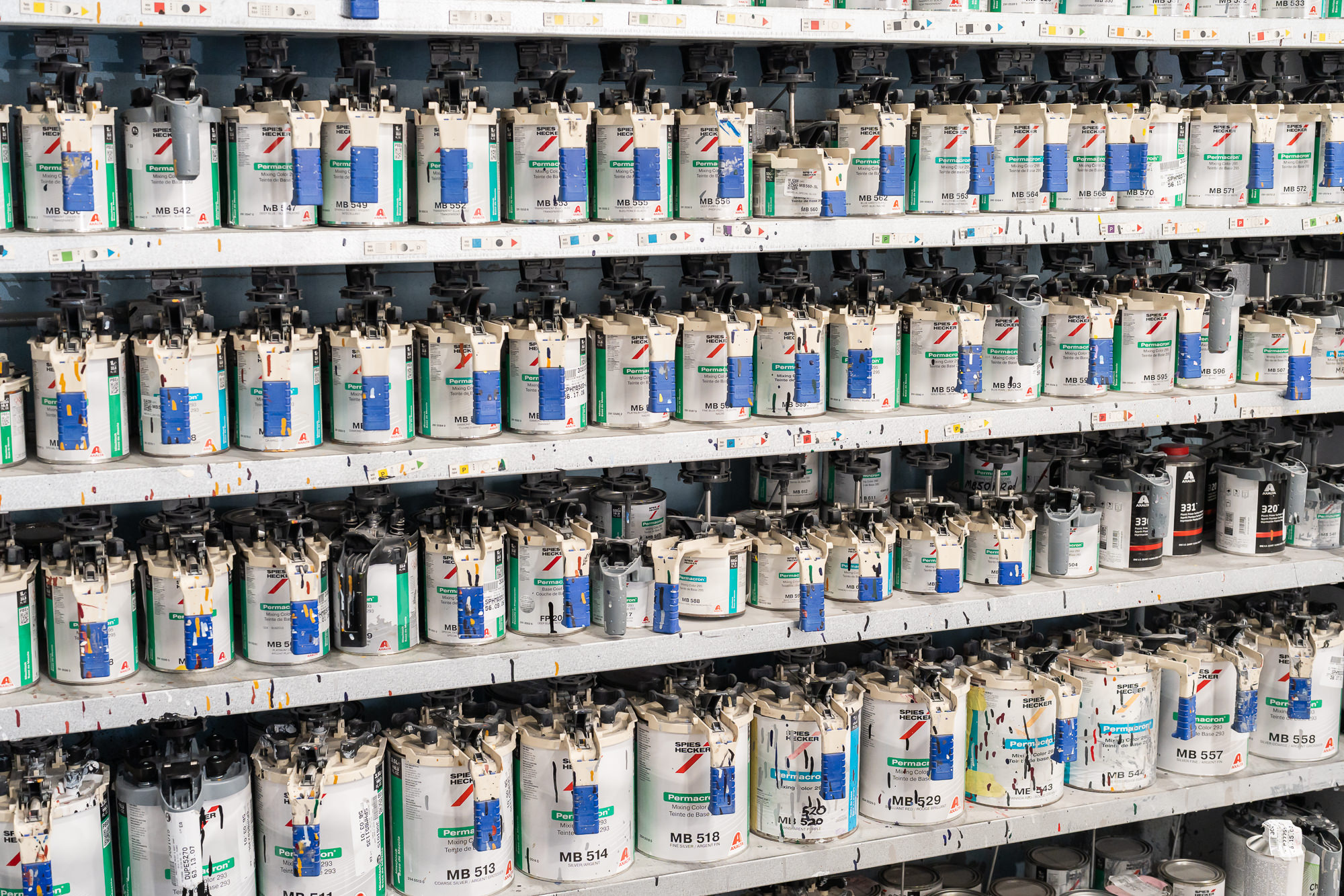 Spies Hecker Permacron premium paint wall — hundreds of color canisters