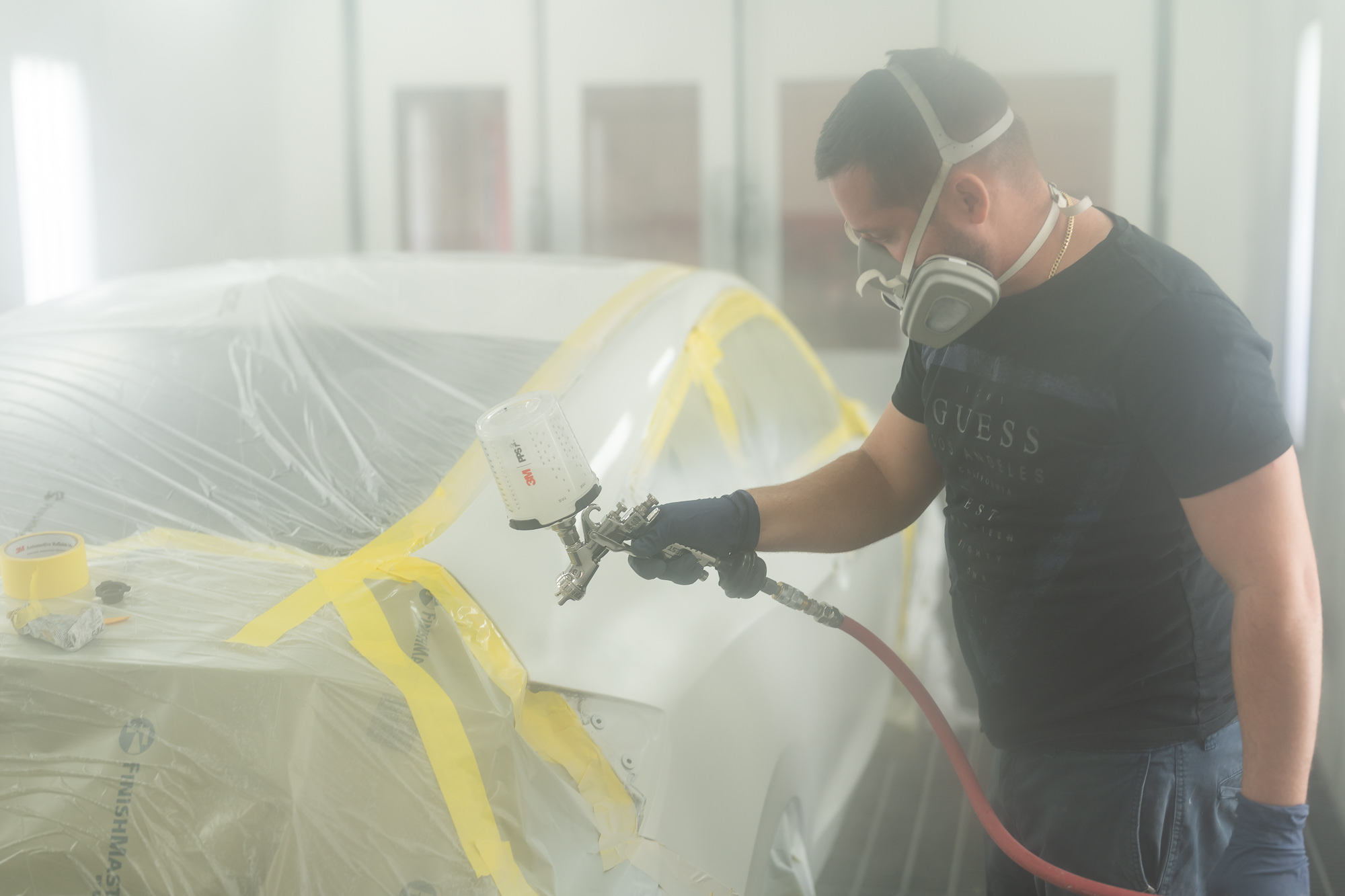 Auto paint specialist in professional spray booth